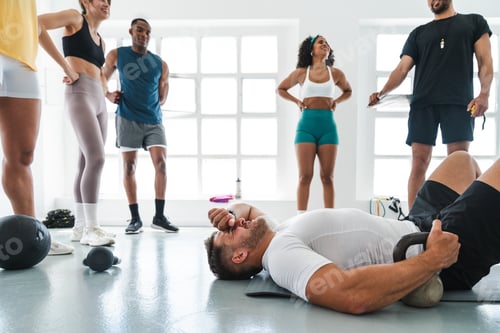 Preview: Tired athlete resting after intense functional training workout