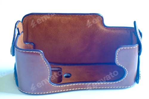 Preview: Case For The Camera. Leather Case On Green Background.