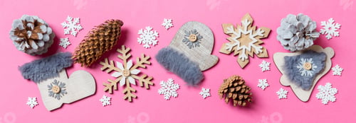 Preview: Top view of holiday toys and decorations on pink Christmas background. Banner