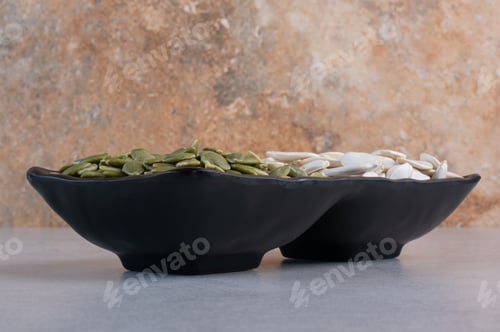 Preview: Green cleaned and white pumpkin seeds on concrete background