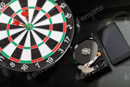 Preview: Winchester with mobile phone and Darts at targets on dark background