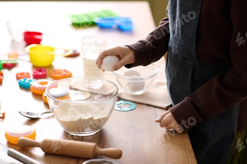 Preview: Joyful moments in the kitchen with a little boy creating sweet memories during baking time