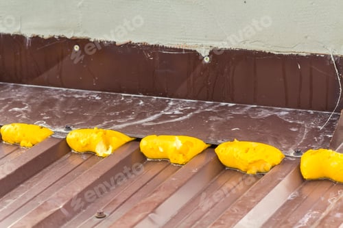 Preview: Close-up of repair with construction foam on a metal roof