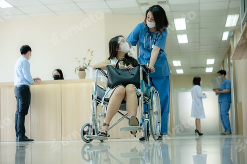 Preview: Smiling young female doctor in scrub and covid-19 face mask in conversation with patient
