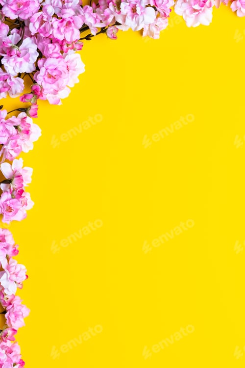 Preview: Spring flowers. Cherry blossom on a yellow paper background. Floral frame border. Template