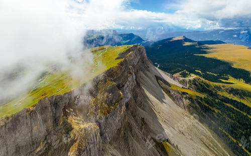 Preview: Aerial View of Steaming Mountain covered by clouds