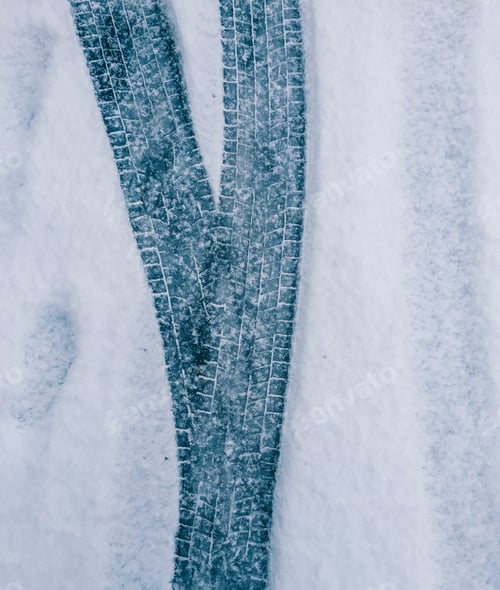 Abstract Winter Background with Vehicle Tire Tracks