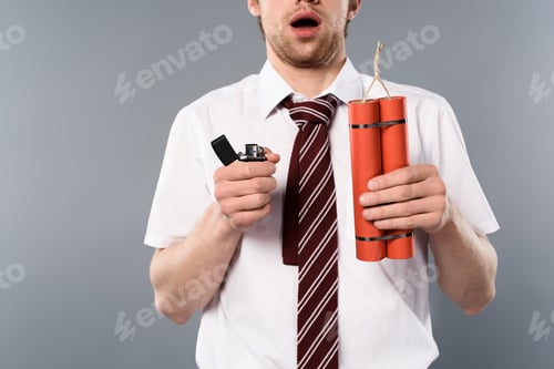 Preview: cropped view of shocked businessman holding lighter and dynamite on grey background