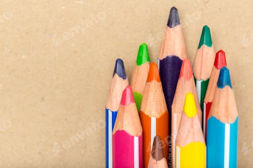 Preview: Colorful pencils arranged on a plain surface for drawing and crafting activities in a creative space