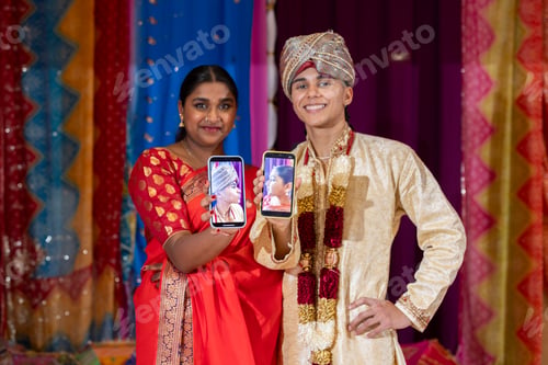 Preview: Traditional Indian Couple Taking a Selfie in Festive Attire