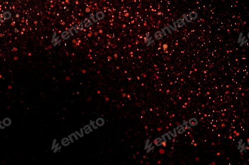 Preview: Beautiful, sparkling red glitter pouring down from above on a dark background