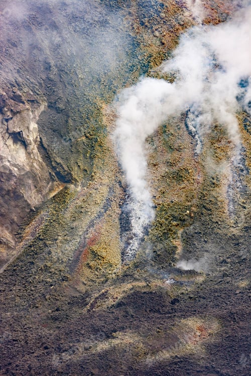 Preview: Aerial view of fog over a rocky hill