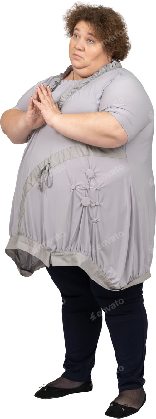 Preview: a woman wearing a large gray top and black pants