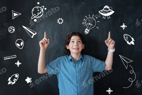 Preview: Curious Boy. Adorable Little Happy Boy Pointing To The Sky And Looking Up While Dreaming About
