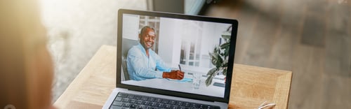 Preview: Businesswoman making online videoconference and discuss project with colleague in cafe near window