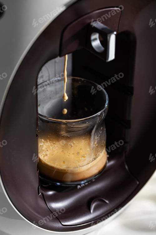 Preview: Coffee machine pours espresso into a cup