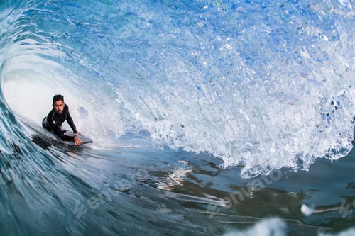Preview: Man surfing in sea, Encinitas, California, USA