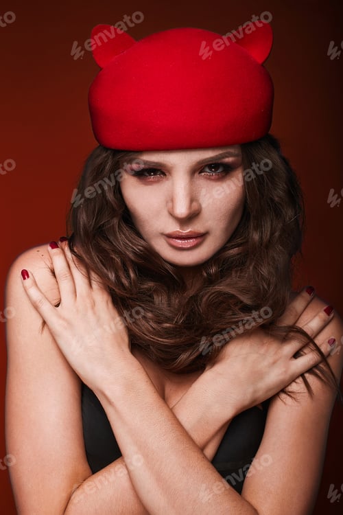Preview: Beauty Portrait Of Young Swag Sexy Woman With Curly Long Hair In Cat Hat On Red Background In