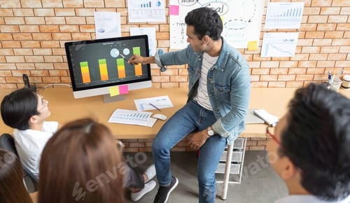 Preview: Indian business man and his team presentation on screen monitor