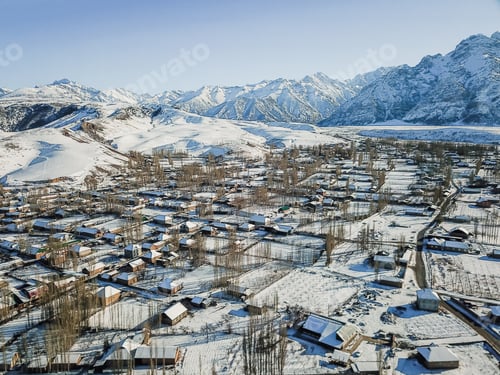 Preview: Village With Snow Capped Mountains