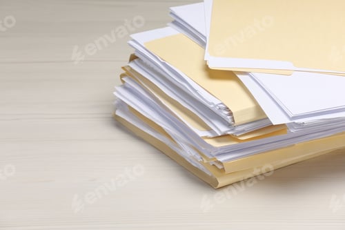Preview: File folders with papers on wooden table, closeup. Space for text