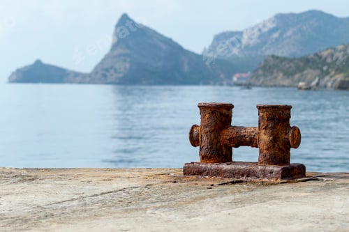 Preview: Knechts on pier against backdrop of sea and mountains.