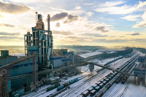 Preview: Aerial view of cement plant with high factory structure at industrial production area.