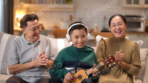 Preview: Happy family, grandmother, grandfather and grandson have a good time together in the kitchen.