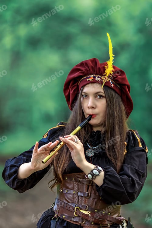 Vista previa: A woman with a flute. A girl in a large burgundy beret with feathers plays a pipe.Medieval dress