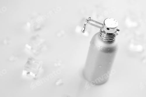 Preview: Gray Metal Bottle Surrounded by Ice Cubes