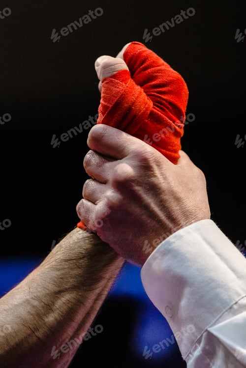 Preview: referee raises hand of boxer is winner