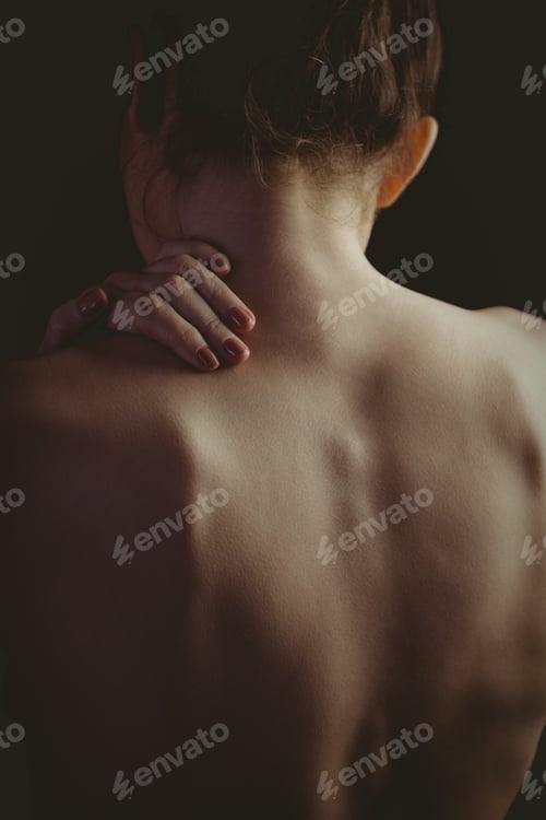 Preview: Woman's Back in Shadow with Hand on Neck
