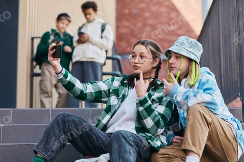 Preview: Friends making selfie portrait on smartphone