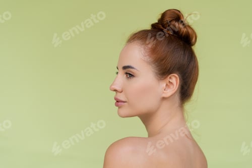 Preview: Beauty portrait of young topless red hair woman with bare shoulders on green background with perfect