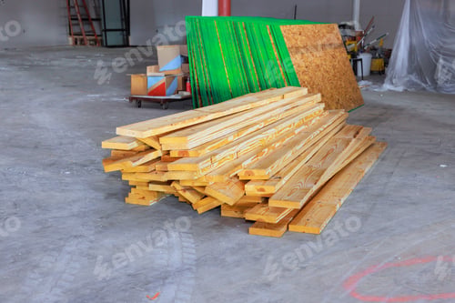 Preview: Wooden boards stacked on a construction site are ready for use