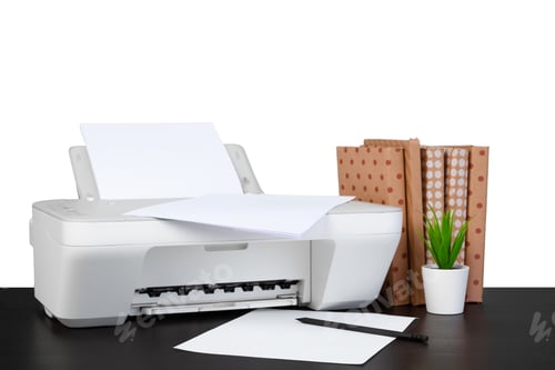Preview: Printer and stack of books on black table against white background