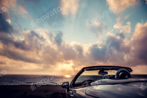 Preview: Cabriolet against blue sky background