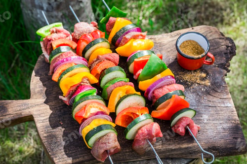 Preview: Fresh vegetables and meat with herbs on grill