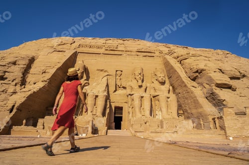 Preview: A European tourist in red dress at the Abu Simbel Temple in southern Egypt