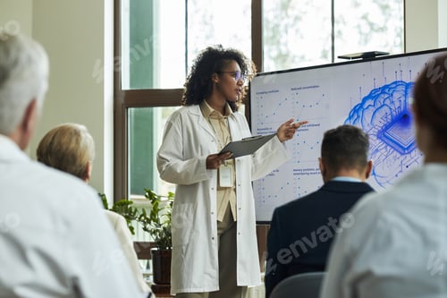 Preview: Young Black Woman Explaining Medical Data to Diverse Group of Professionals