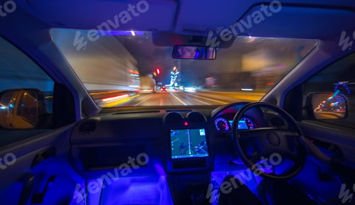 Preview: The man drive on the night road. Left side traffic. Wide angle