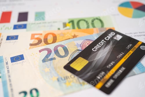 Preview: Credit card with Euro banknotes on chart and graph paper. Finance development, Banking Account.