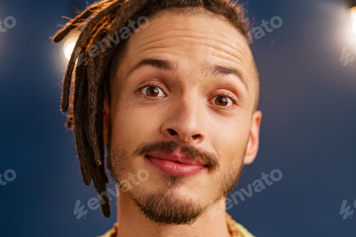 Preview: Portrait of a happy positive guy with dreadlocks