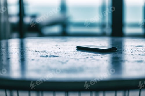 Preview: A single black mobile phone on the table