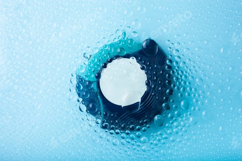 Preview: asthma inhaler medicine through water drop background. medical treatment