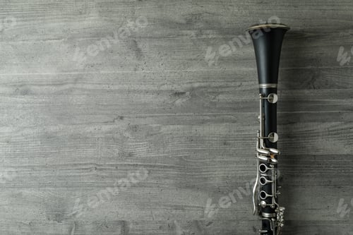 Preview: Clarinet on gray textured table, space for text