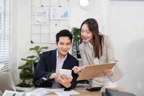 Preview: Financial Insights. Professionals analyzing data together in a modern office.