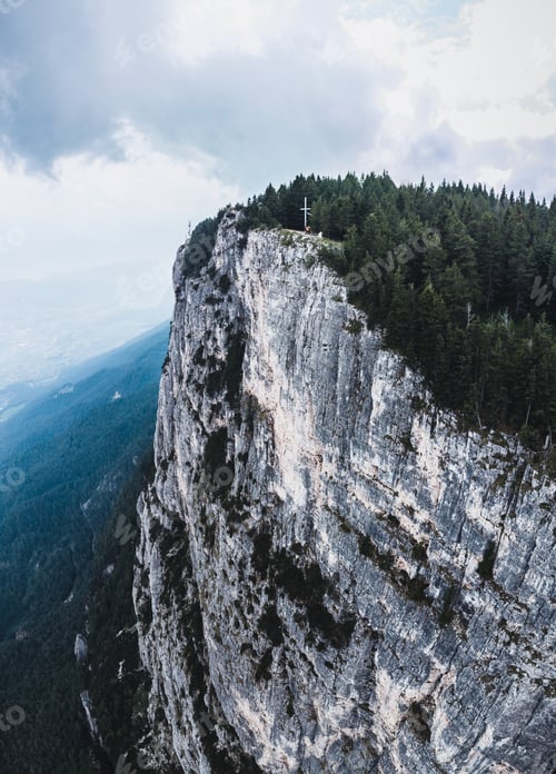 Preview: Vertical shot of a breathtaking landscape under the cloudy skies