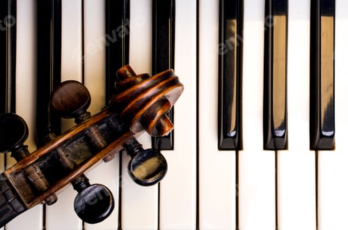 Preview: old violin on piano keys