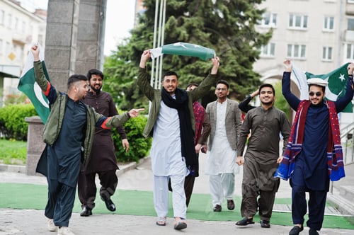 Preview: Group of pakistani man wearing traditional clothes salwar kameez or kurta with Pakistan flags.